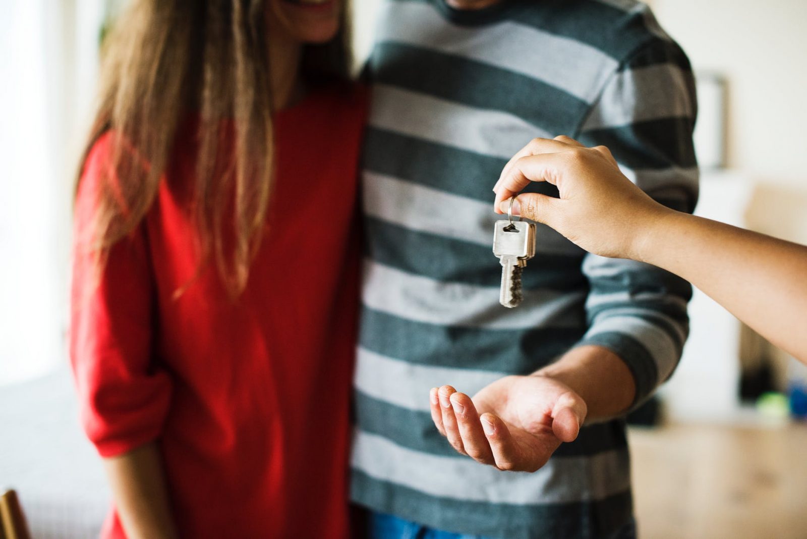 Couple Getting Keys to Foreclosed House